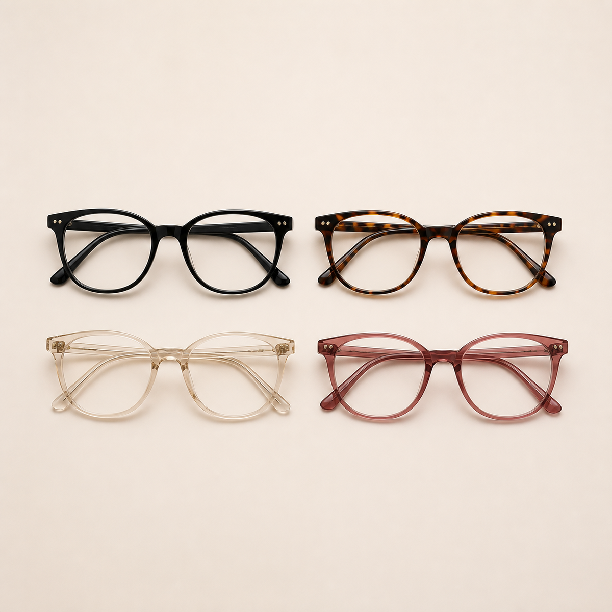 Four-pack of reading glasses in black, tortoiseshell, clear, and berry