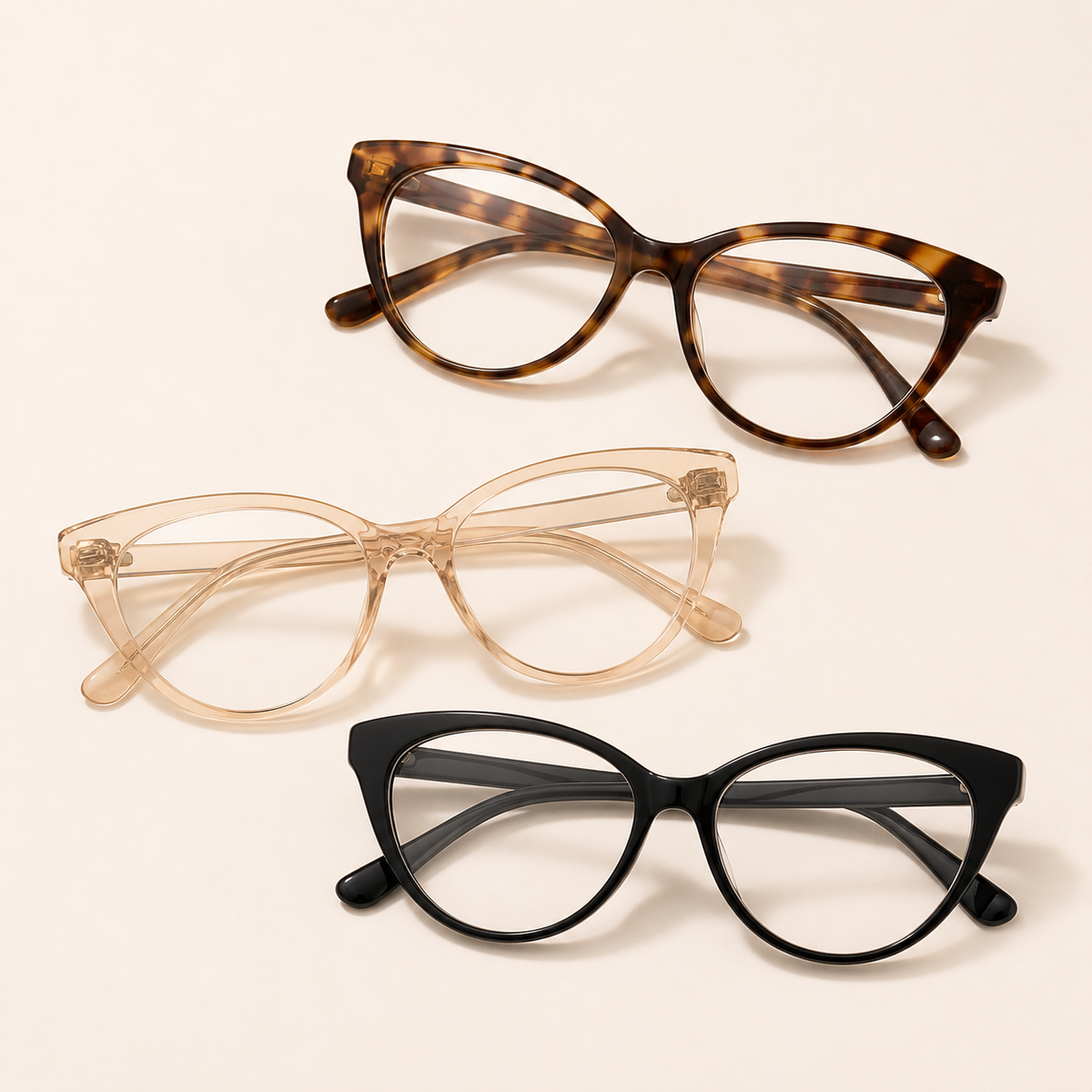 Cat-eye reading glasses in tortoiseshell, champagne, and black frames