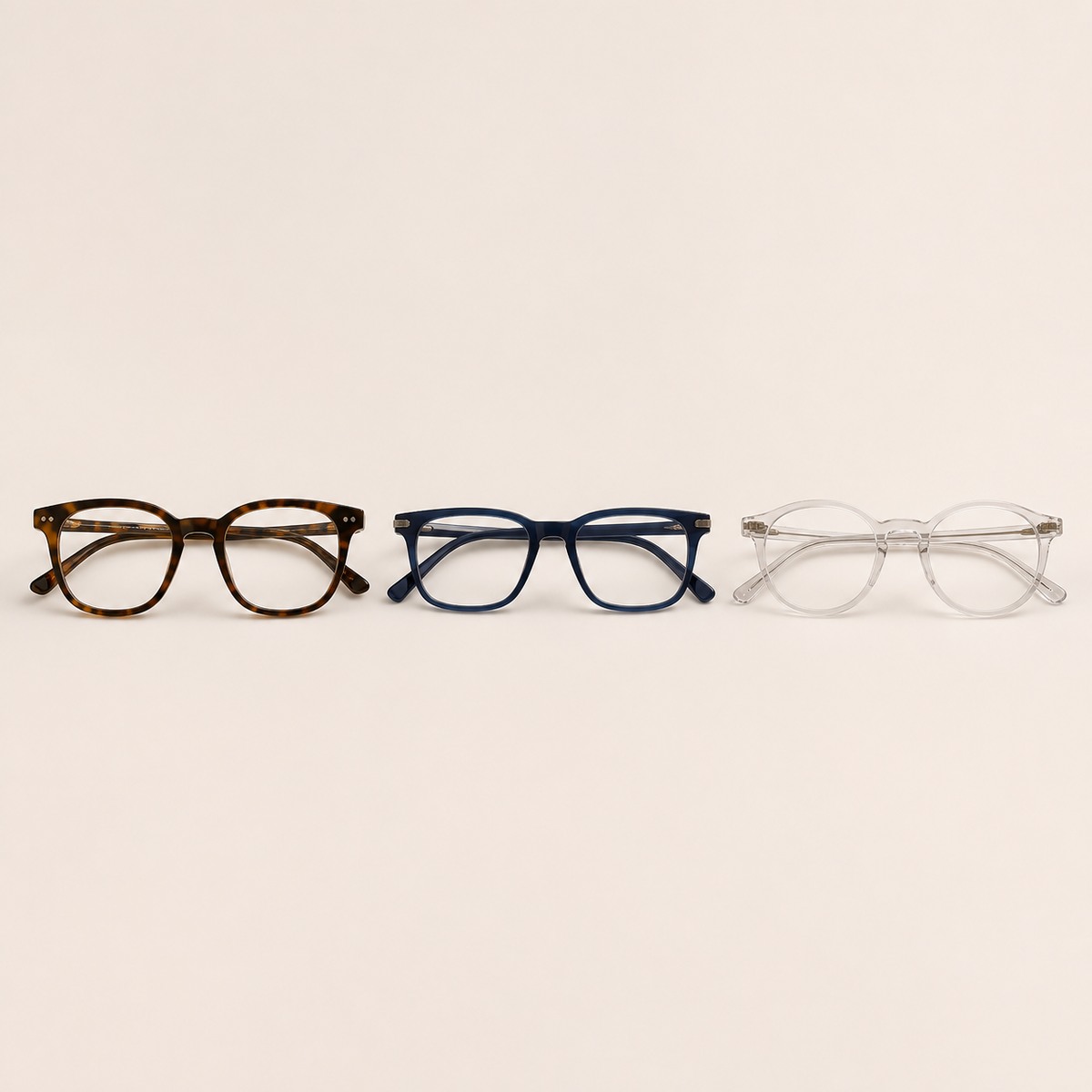 Unisex reading glasses in tortoiseshell, navy, and clear styles